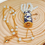 Load image into Gallery viewer, Life Of A Bird Rotating Pearl Chain Necklace