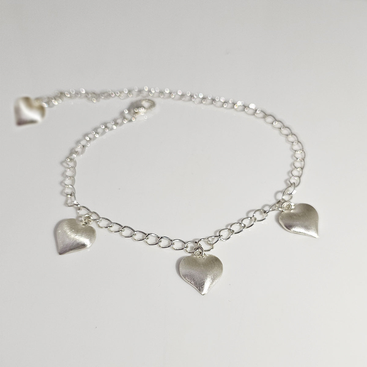 Hanging hearts bracelet in 925 silver