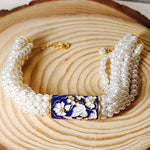 Load image into Gallery viewer, Life Of A Bird Rotating Pearl Ponchi Bracelet
