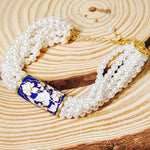 Load image into Gallery viewer, Life Of A Bird Rotating Pearl Ponchi Bracelet
